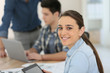 © goodluz - Portrait of student girl using digital tablet in class