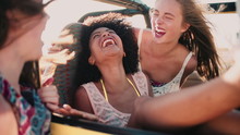 Afro Girl Laughing With Friends On Road Trip Slow Motion