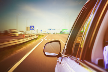 Poster - Blurred road and car