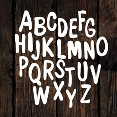 Hand-drawn Alphabet on Wooden Texture