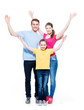© Valua Vitaly - Cheerful family with child raised hands up.