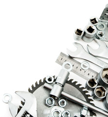 Metalwork. Spanner, ingot and others tools on white background.