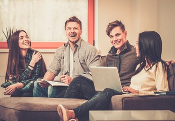 Group of students preparing for exams in apartment interior