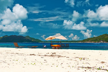 Tropical Beach At Seychelles With Picnic Table And Chairs