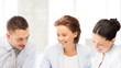 © Syda Productions - business team discussing something in office