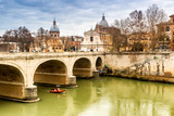 Fototapeta Pomosty - Bridge over the Tiber river in the center of Rome