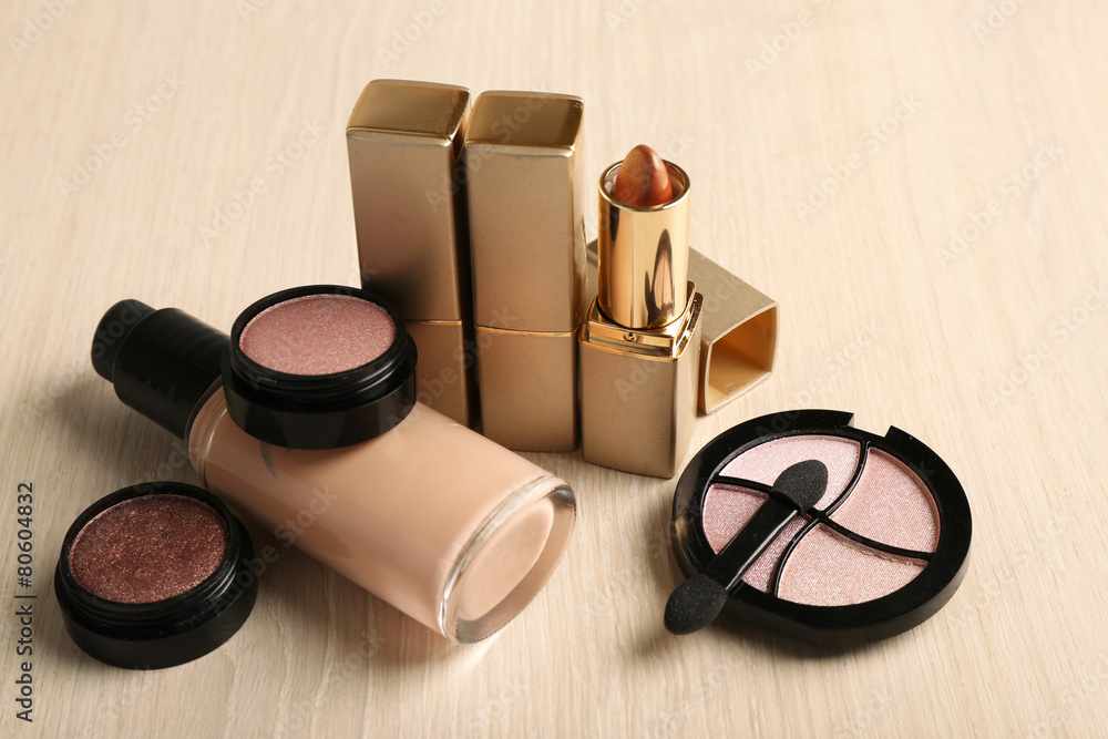 Set of decorative cosmetics on wooden table background