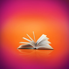 Wall Mural - Opened book on bright color background