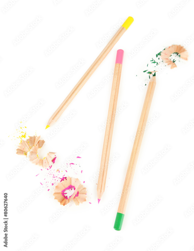 Wooden colorful pencils with sharpening shavings, isolated