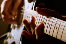 Hands Of Man Playing Electric Guitar