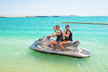Couple On The Jetski At The Beach Of Abu Dhabi, UAE