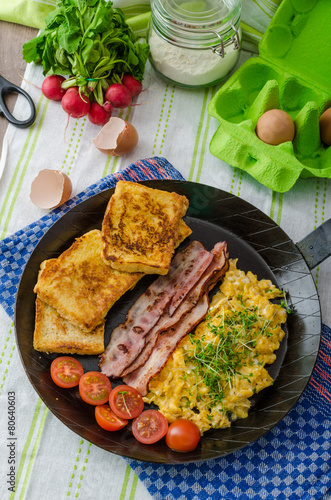 Scrambled eggs with bacon and French toast Stock Photo | Adobe Stock