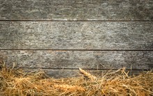 Straw And Wheat On A Rustic Wooden Background With Copy Space