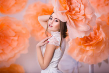 Portrait Of Young Beautiful Girl In Paper Flowers
