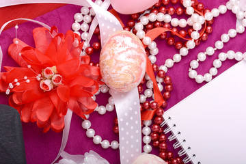 Easter background with eggs, ribbons and spring decoration