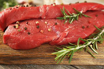 Wall Mural - Raw beef steak with rosemary and spices