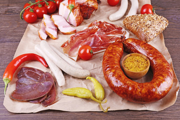 Sticker - Assortment of deli meats on parchment, closeup