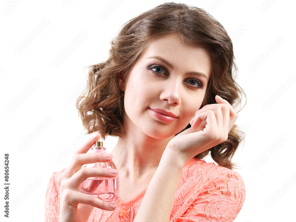 Beautiful woman with perfume bottle isolated on white
