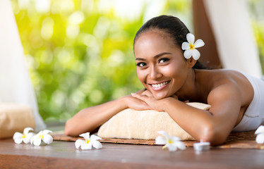 Wall Mural - Beautiful smiling woman relaxing after massage