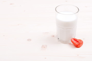 Canvas Print - milk, almonds, raisins, dried apricots on the table top view