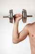 © Pitcher - Hand holding chrome dumbbell on the white background.