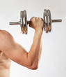 © Pitcher - Hand holding chrome dumbbell on the white background.