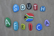 South Africa, souvenir on painted stones with national flag