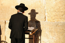 Religious Orthodox Jew Praying At The Western Wall In Jerusalem.