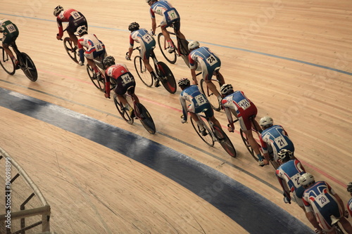 Nowoczesny obraz na płótnie cyclists to ride fast in a curve top view