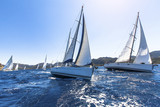 Fototapeta  - Sailing in the wind through the waves at the Aegean Sea.