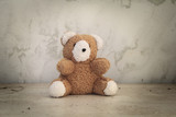 Fototapeta  - Retro Teddy Bear toy alone on wooden floor