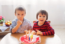 Adorable Cute Boys, Blowing Candles On A Birthday Cake