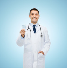 Sticker - smiling male doctor in white coat with tablets