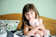 © Alinute - Adorable little girl awaked up in her bed