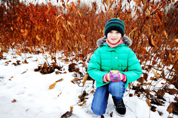 Wall Mural - Adorable kid girl outside in early spring