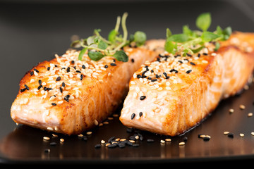 Wall Mural - Grilled salmon on black plate two