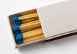 White box of matches with blue tips