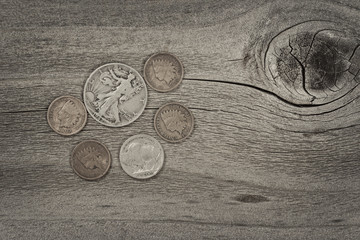 Concept of vintage coins on aged wood