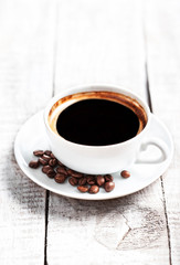 Poster - Coffee Espresso. Coffee cup with roasted coffee beans over white