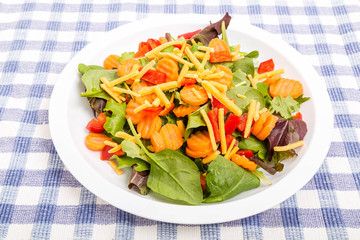 Wall Mural - Spinach Salad with Carrots Peppers and Cheese