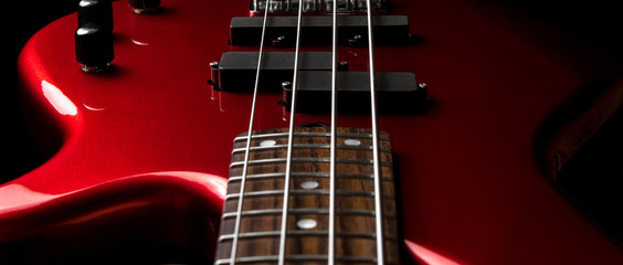 Bass guitar close-up. Photo in low key