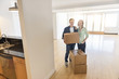© tmc_photos - Happy Mature Couple With Cardboard Boxes At New Home