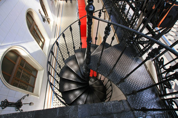 Wall Mural - Old metal spiral staircase with iron railing