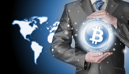 Businessman with protective gesture bitcoins