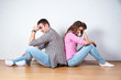 © Elena Kharichkina - Couple sitting with their backs turned after having an argument