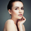 © Elena Kharichkina - Beautiful Young Woman Touching Her Face.