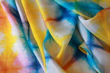 Rippled surface of light silk dyed in shades of nature in summer