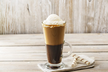 cold coffee with ice cream in a glass