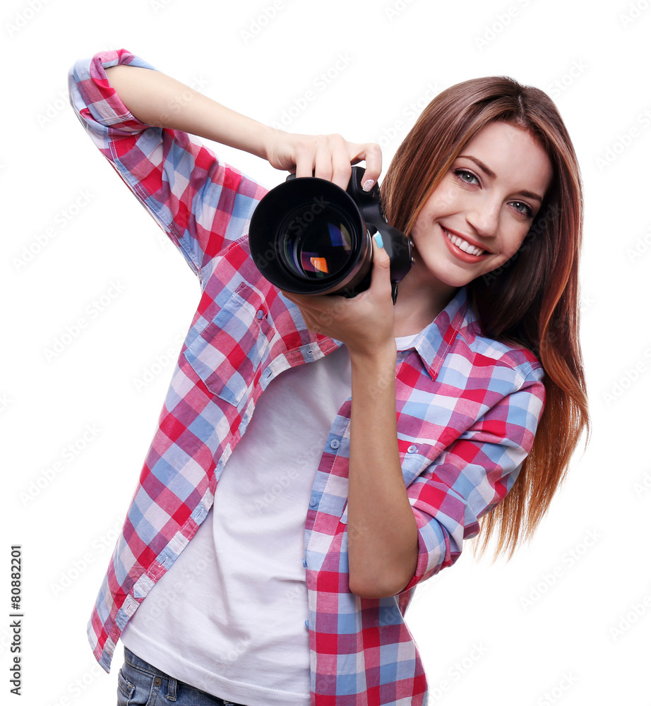 Young female photographer taking photos isolated on white