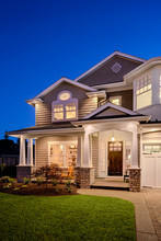 Beautiful New England Style Home Exterior At Night